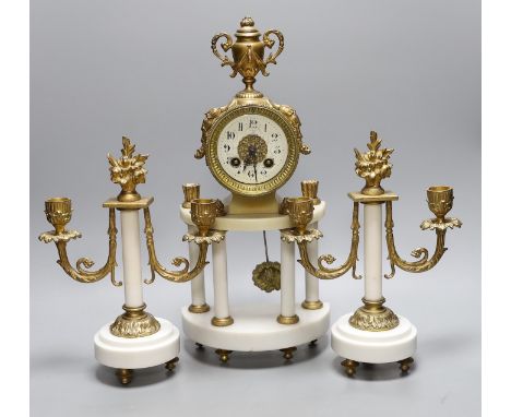 A French white marble and gilt metal clock garniture,43 cms high,