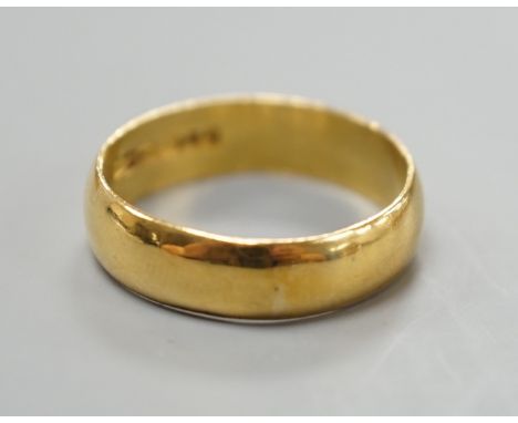 A 1960's 22ct gold wedding band, size R/S, 5.7 grams.