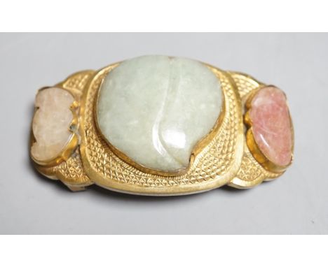 A Chinese jade and hardstone mounted belt buckle, late 19th/early 20th century the central green jade peach shaped stone flan