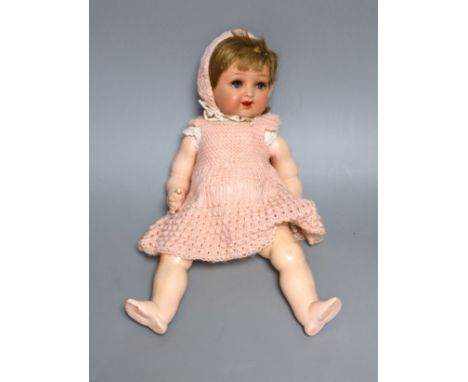 A Heubach Koppelsdorf open mouthed bisque headed doll,34 cms high,