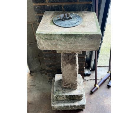 A sectional carved stone sundial with cast brass scale and gnomon, height 96cm