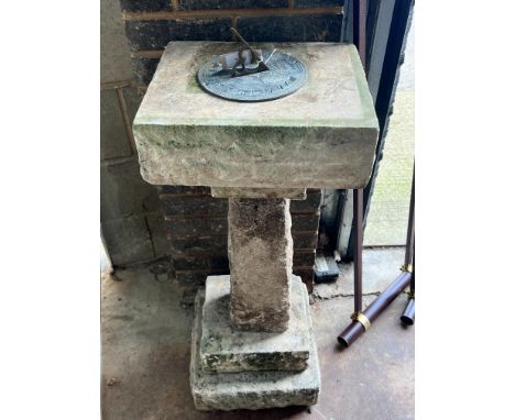 A sectional carved stone sundial with cast brass scale and gnomon, height 96cm