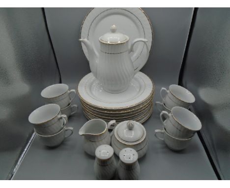 Trade winds white and gold part dinner service 21 pieces comprising of 8 plates, 8 cups, s&amp;p pots, teapot sugar bowl and 