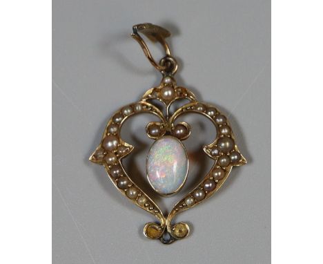 9ct gold Art Nouveau pendant set with an opal and seed pearls.  Pearls missing.  Approx weight 2.4 grams.(B.P. 21% + VAT) 