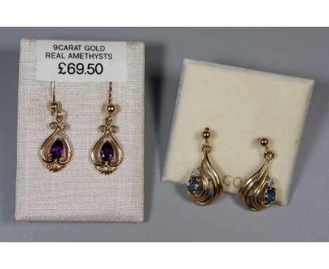 A pair of 9ct gold sapphire and diamond drop earrings and a pair of 9ct gold and amethyst drop earrings.(B.P. 21% + VAT) 