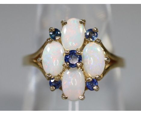 9ct gold opal and sapphire cluster ring. Ring size N. Approx weight 3.7 grams. (B.P. 21% + VAT) UK import marks