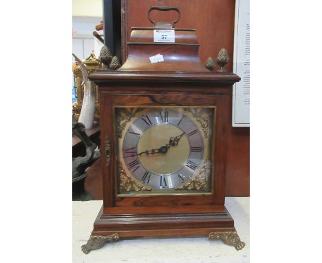 Early 20th Century rosewood cased bracket clock with caddy top and pineapple finials over later brass face with Roman chapter