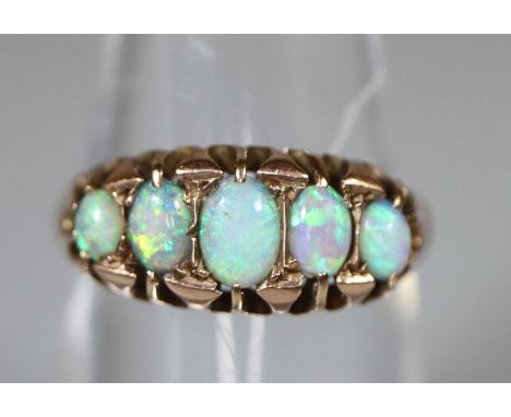 9ct gold five stone graduated opal ring.  Ring size M.  Approx weight 2.1 grams.(B.P. 21% + VAT) 