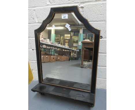 Ebonised and gilded hanging wall mirror with under-shelf. 70cm high approx.(B.P. 21% + VAT) 