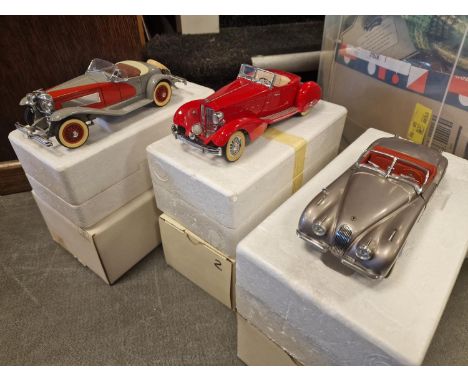 Trio of Four Boxed Danbury Mint Model Toy Cars inc 1949 Jaguar XK 120, 1934 Packard LeBaron, and a 1935 Duesenberg