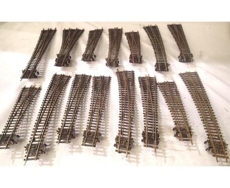Fifteen Peco OO scale points fitted with point motors and weathered, including three way, all in good condition, ex layout. P