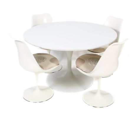 A vintage white metal 'Tulip' table and four chairs. The table of circular form, mounted on a tapered cast metal stand with a