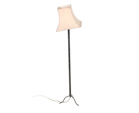 A mid-century standard lamp. Having a pink shade and metal bamboo effect stem, on a tripod base, H150cm