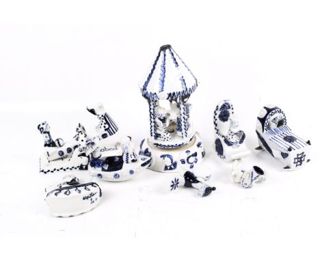A collection of eight circa 1960s Wilfred Gibson blue and white studio pottery items. Including fair ground rides and musicia