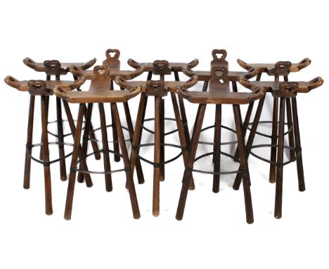 Ten vintage brutalist bar stools. The frame constructed of wood with three handles to the seat and three legs united by a met