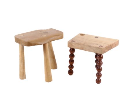 Two vintage wooden footstools. One having a naturalistic top, on three turned and tapered supports, H30cm x W29cm x D20cm, th
