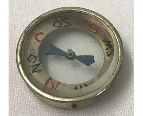 A WWII style Luftwaffe Pilot's escape compass.  Approx. 2cm diameter.