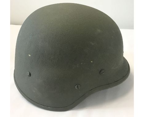 A 1998 Italian Army kevlar helmet with interior suspension lining and chin strap.  From a private collection.