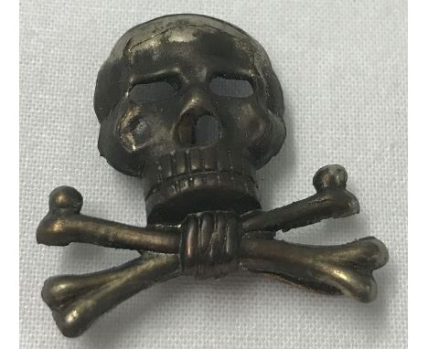 A German Brunswick skull cap badge with slider fixings to reverse.  Approx. 3cm long.