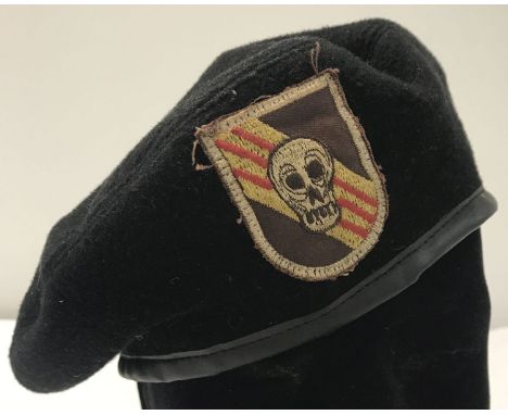 A Vietnam War style US "Bright Light", Special Forces P.O.W Recovery Team beret with badge.  Size 58.