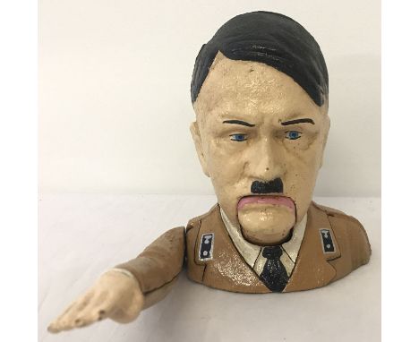 A painted cast iron novelty nutcracker with moving arm and mouth action.  Approx. 17.5cm tall.
