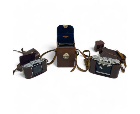 Three Vintage cameras compromising a Wallace Heaton plate camera, a Zeiss Ikon and a Agifold (3).