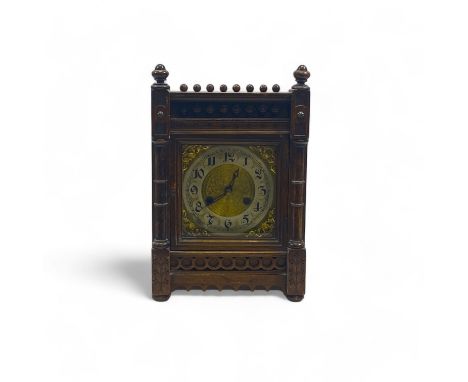 A Victorian walnut and pine mantle clock, striking on a gong. 23cm by 16cm by 36cm high.