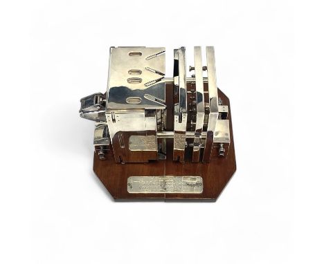 A silver presentation projection molding tool presented to Brian Miskin on his retirement from Massmould Holdings Ltd, 21st M
