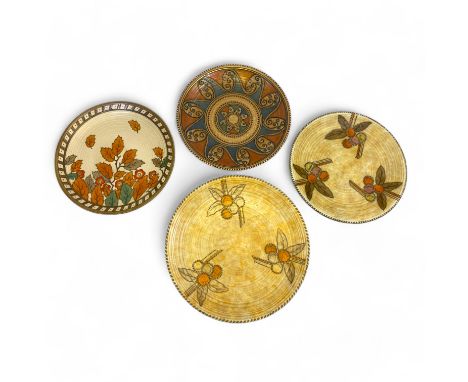 Four Charlotte Rhead Chargers, comprising two in the 5982 Round Fruit pattern, the pale ground punctuated with fruiting branc