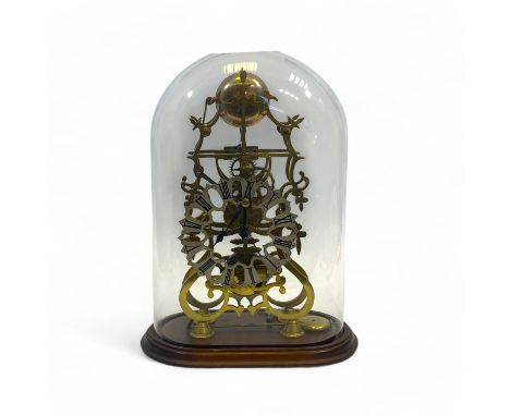 An early 20th century brass skeleton clock, with a silvered chapter ring with Roman numerals, a fusee movement and striking o