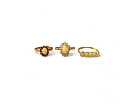 Three 9ct opal gold rings sizes Q, V, total weight 6.4g (3).