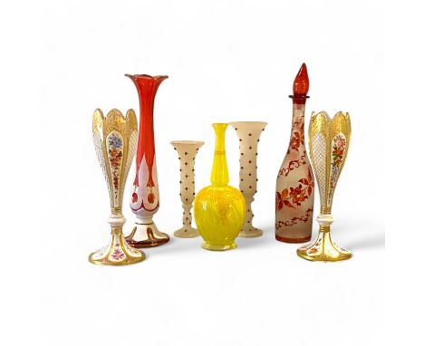 A pair of 19th century Bohemian glass vases, with all over gilt foliate decoration, overlaid with white enamel panels of alte