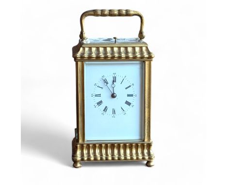 An early 20th century French brass repeating carriage clock, with a pagoda case, striking on a gong  17.5cm high