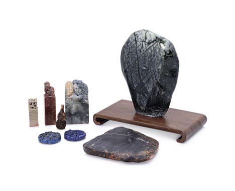 A GROUP OF ORIENTAL STONE OBJECTS AND SEALS
Including carved seals, stone specimens etc
The largest item 23cm high
Condition: