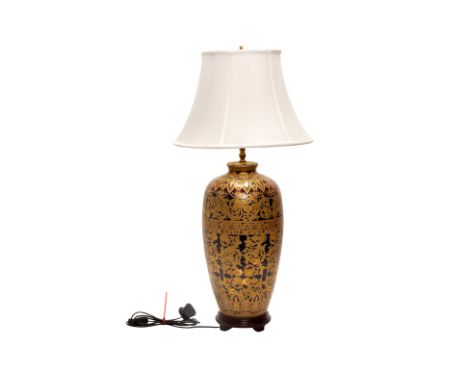 A LARGE GILT AND BLUE GLAZED TABLE LAMP
With shade
82cm high including shade
Condition: Condition Report
In working condition