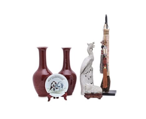 A GROUP OF SIX ORIENTAL ITEMS
Comprising: a jade model of a mythical beast, on wood stand; a pair of 20th century red glazed 