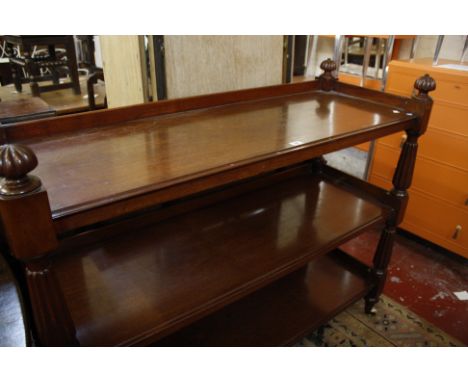 A Victorian mahogany three tier buffet with reeded turned supports 134cm wide 