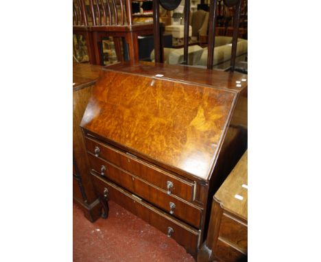 An Edwardian side table and a walnut bureau and a walnut dressing table with three section mirror, five short drawers on cabr