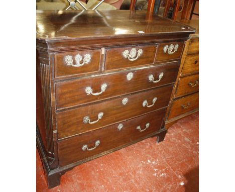A mahogany chest of three short and three long drawers in George III style with canted corners and bracket feet, 109cm wide