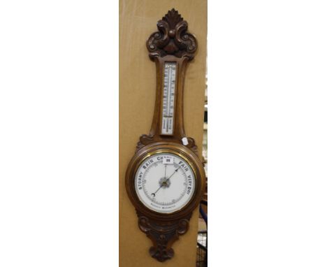 An oak wheel barometer 