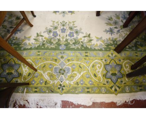 A Kashmir carpet, green on ivory ground 280 x 370cm 