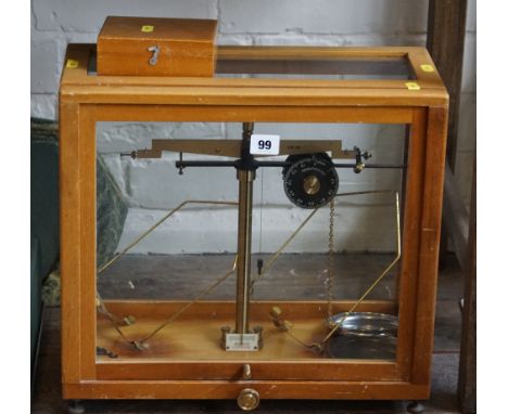 Set of chemist's brass balance scales in glass case with weights with microid chain dial