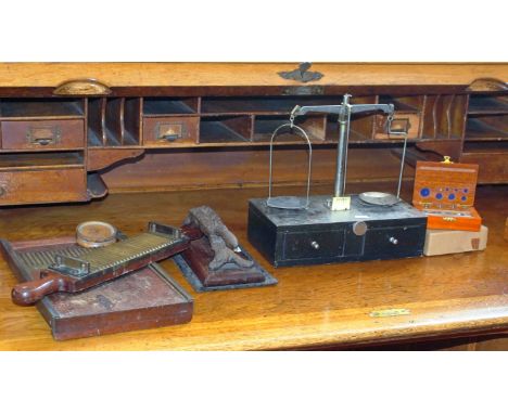 Chemist's wood and brass pill maker, Victorian cork press together with a set of ebonised wood and chrome scale weights and a