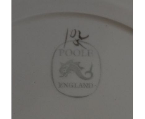 Five Poole Pottery dinner plates and five side plates with two different patterns of stylized flowers in shades of brown and 
