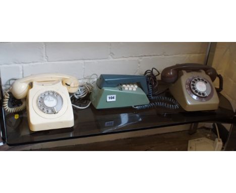 Two 1970/80s rotary dial telephone models 746 - one cream and one mushroom/brown together with a green push button trim phone