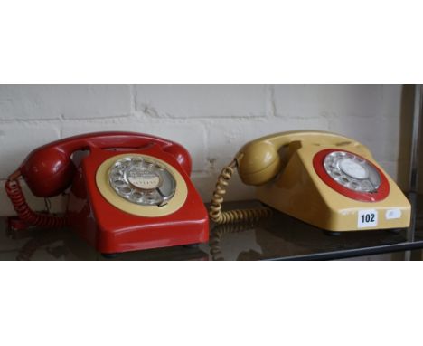 Two 1970/80s two-tone red and cream rotary dial telephones models 746F