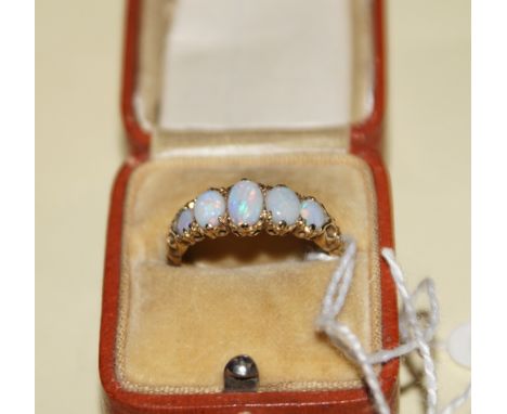 9 ct gold five stone opal ring