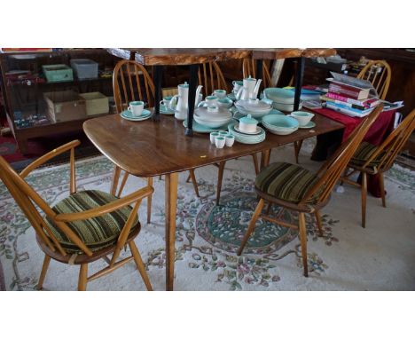 Mid 20th century Ercol Grand-Windsor dining table 152 cm extending to 223 cm together with five single and two Quaker armchai