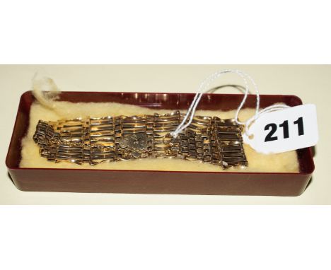Ladies 9 ct gold nine bar gate bracelet with safety chain and lock 19.3 gm