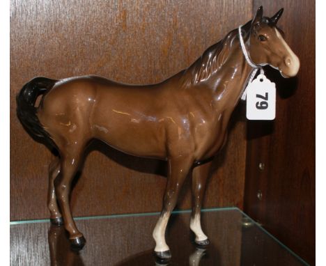 Beswick Pottery model of a brown gloss horse with white stripe down the nose and front white socks